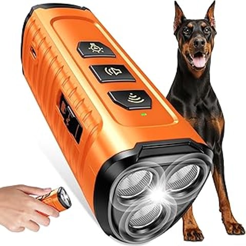 A dog bark deterrent device is shown with a dog standing next to it.