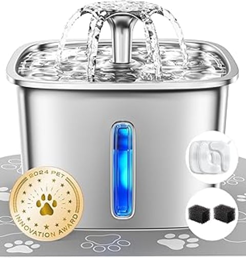 A stainless steel cat water fountain with a blue light.