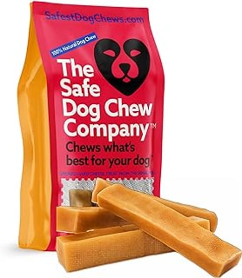 A bag of dog chew with a black and red dog on it.